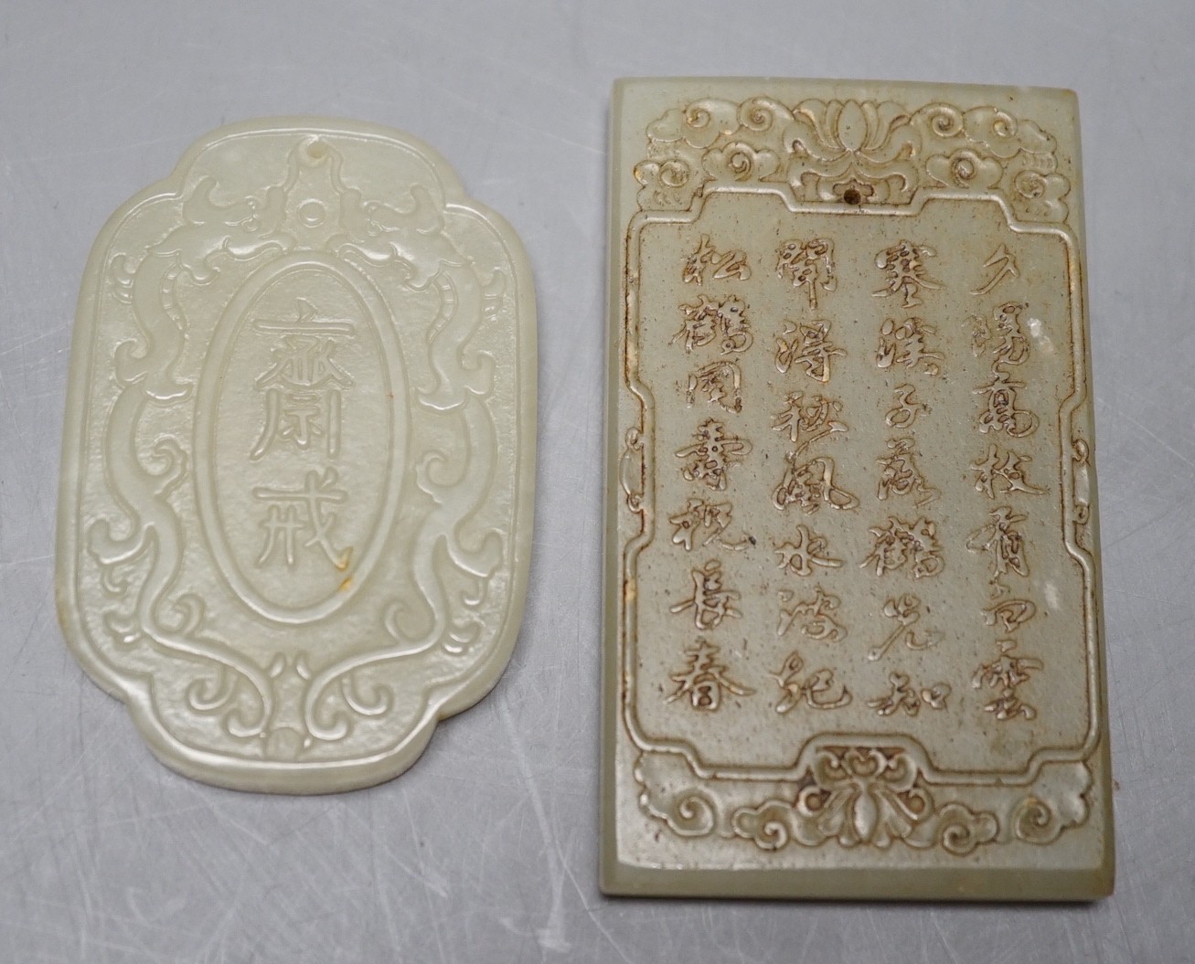 Two Chinese pale celadon jade plaques, largest 7.5 x 4.5cm